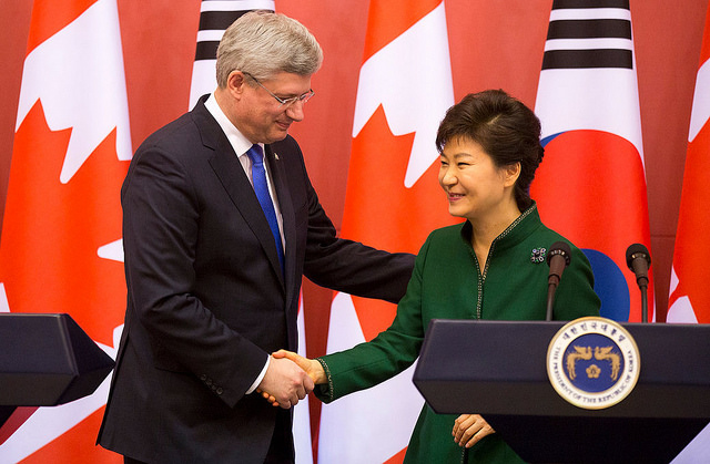 caption: Canadian Prime Minister Stephen Harper and South Korean President Park Geun-hye reach a historic free trade agreement.