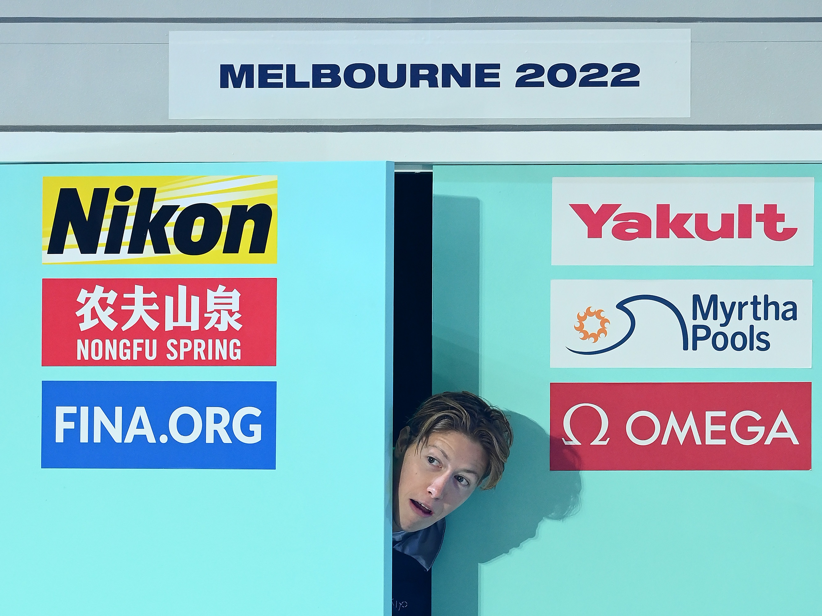 caption: Henrik Christiansen, pictured at a 2022 championship medal ceremony in Australia, is chasing medals as well as chocolate muffins in his third Olympic Games. 