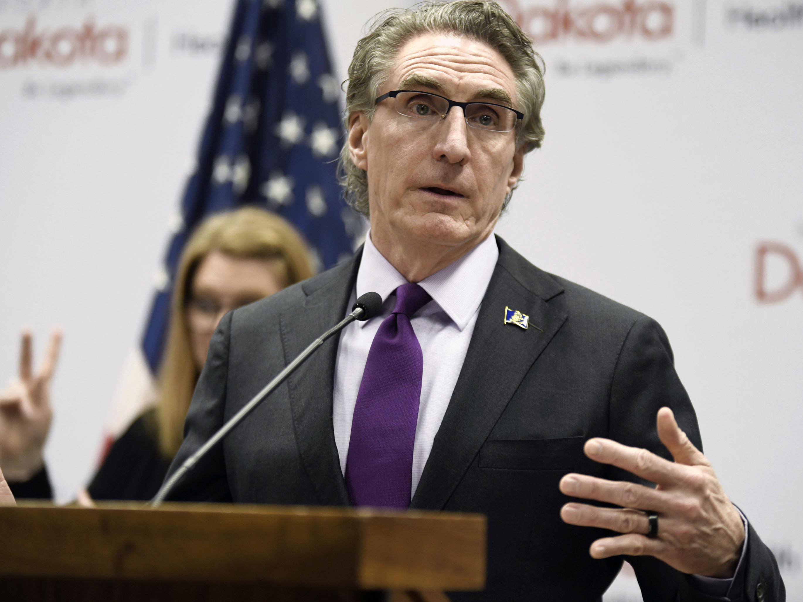 caption: North Dakota Gov. Doug Burgum speaks at the state Capitol on April 10, 2020, in Bismarck, N.D. Burgum has signed a veto-proof bill into law, Thursday, April 20, 2023, that restricts transgender health care and criminalizes providers who give gender-affirming care to people under 18.