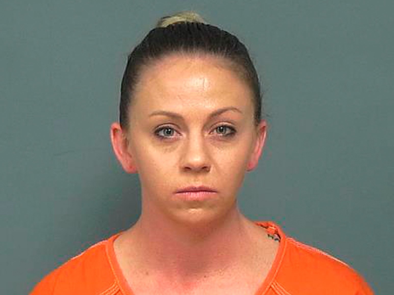 caption: Amber Guyger, the former Dallas police officer who fatally shot an unarmed black man in his own home told a 911 dispatcher, "I thought it was my apartment" several times as she waited for emergency responders to arrive. Guyger is charged in the September, 2018 killing of Botham Jean.