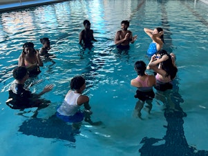 caption: <a href="https://firststrokes.org/" data-key="424">First Strokes</a> is a New York-based organization working to get teens in the water safely — and to try to remove the barriers to learning. Above, a First Strokes class at Hill Regional Career High School in New Haven, Conn.