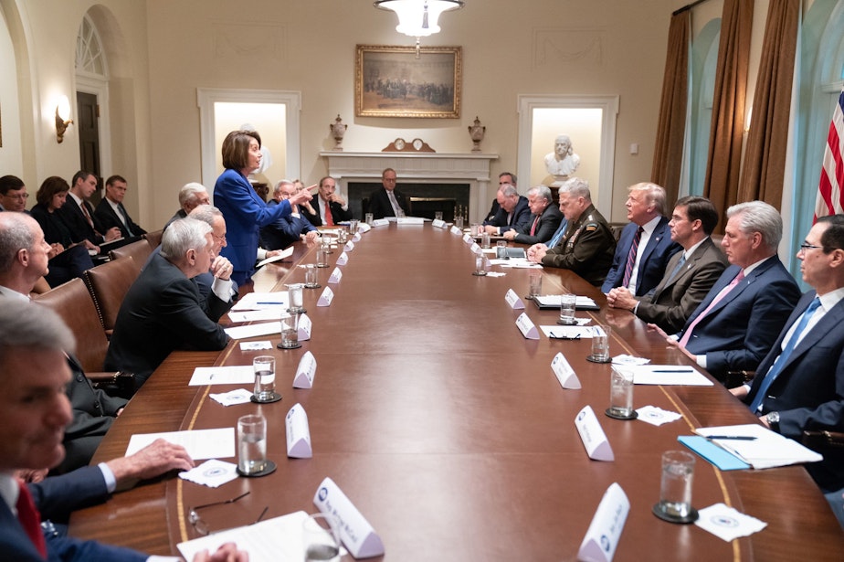 caption: "Nervous Nancy's unhinged meltdown!" President Trump tweeted on Thursday with this photograph of Nancy Pelosi standing up and apparently lecturing him. 