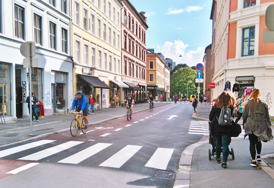 caption: Walkers and bikers on a road in Oslo, Norway. 