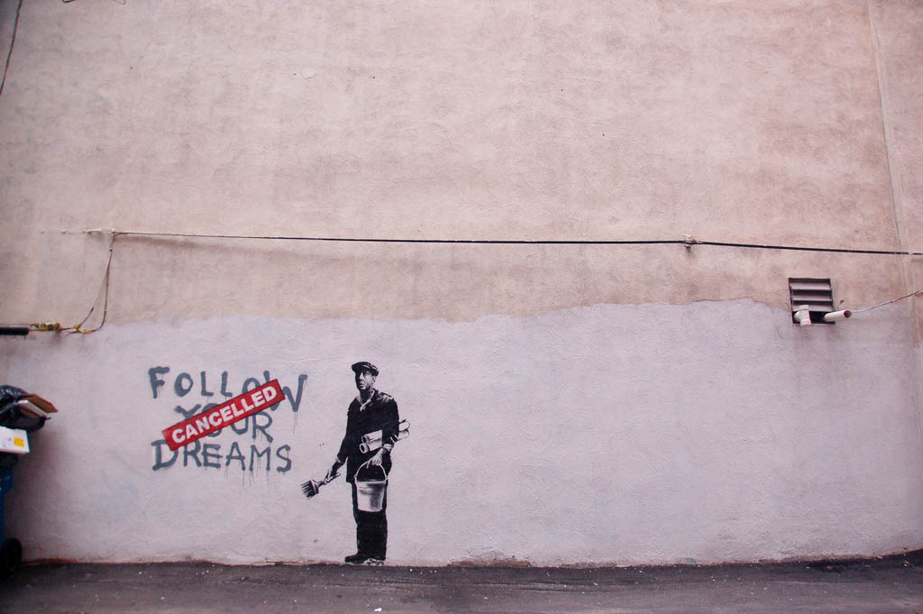caption: A Banksy piece in Boston. Photo taken in 2010.