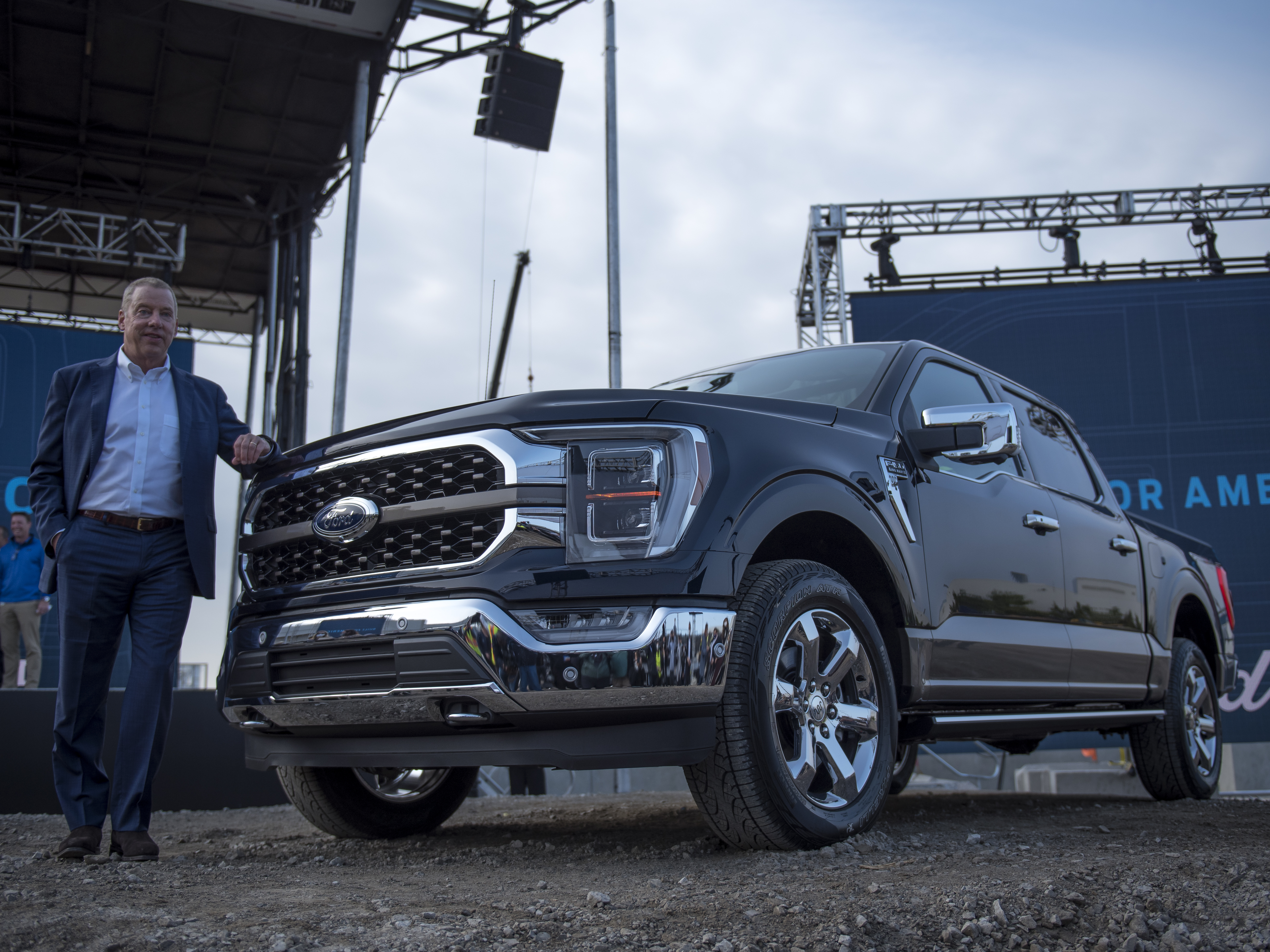 caption: Bill Ford, executive chairman of Ford Motor Co., with the 2021 Ford F-150 King Ranch truck in September in Dearborn, Mich. Strong demand for high-margin vehicles such as pickups has propelled Ford and its rivals to remarkably strong earnings this past quarter.
