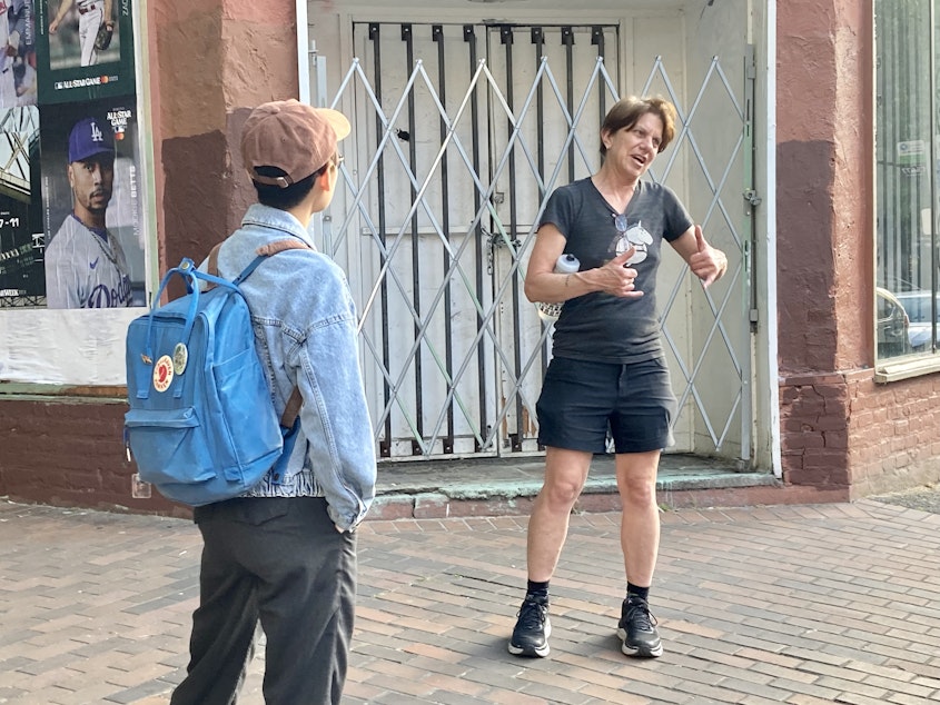 caption: Beneath the Streets tour guide Terrilyn Johnson leads a queer history tour in Pioneer Square on June 23, 2023.