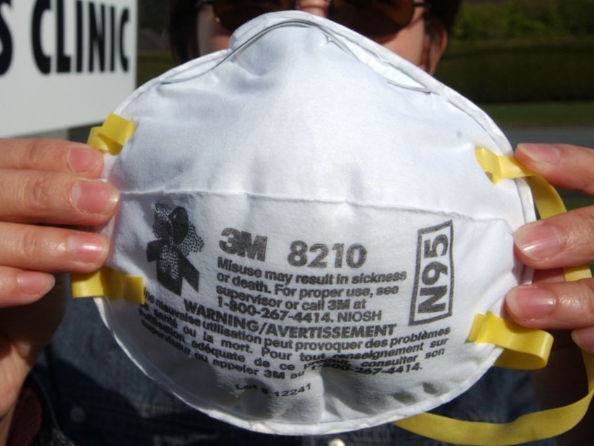 caption: N95 masks are used both as dust masks and as medical equipment.