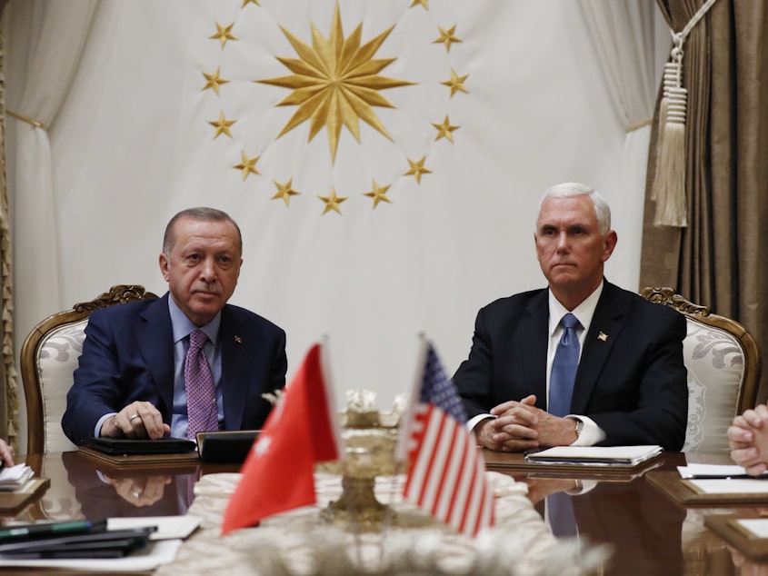 caption: Vice President Mike Pence meets with Turkish President Recep Tayyip Erdogan at the Presidential Palace for talks on the Kurds and Syria on Thursday in Ankara, Turkey.