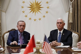 caption: Vice President Mike Pence meets with Turkish President Recep Tayyip Erdogan at the Presidential Palace for talks on the Kurds and Syria on Thursday in Ankara, Turkey.