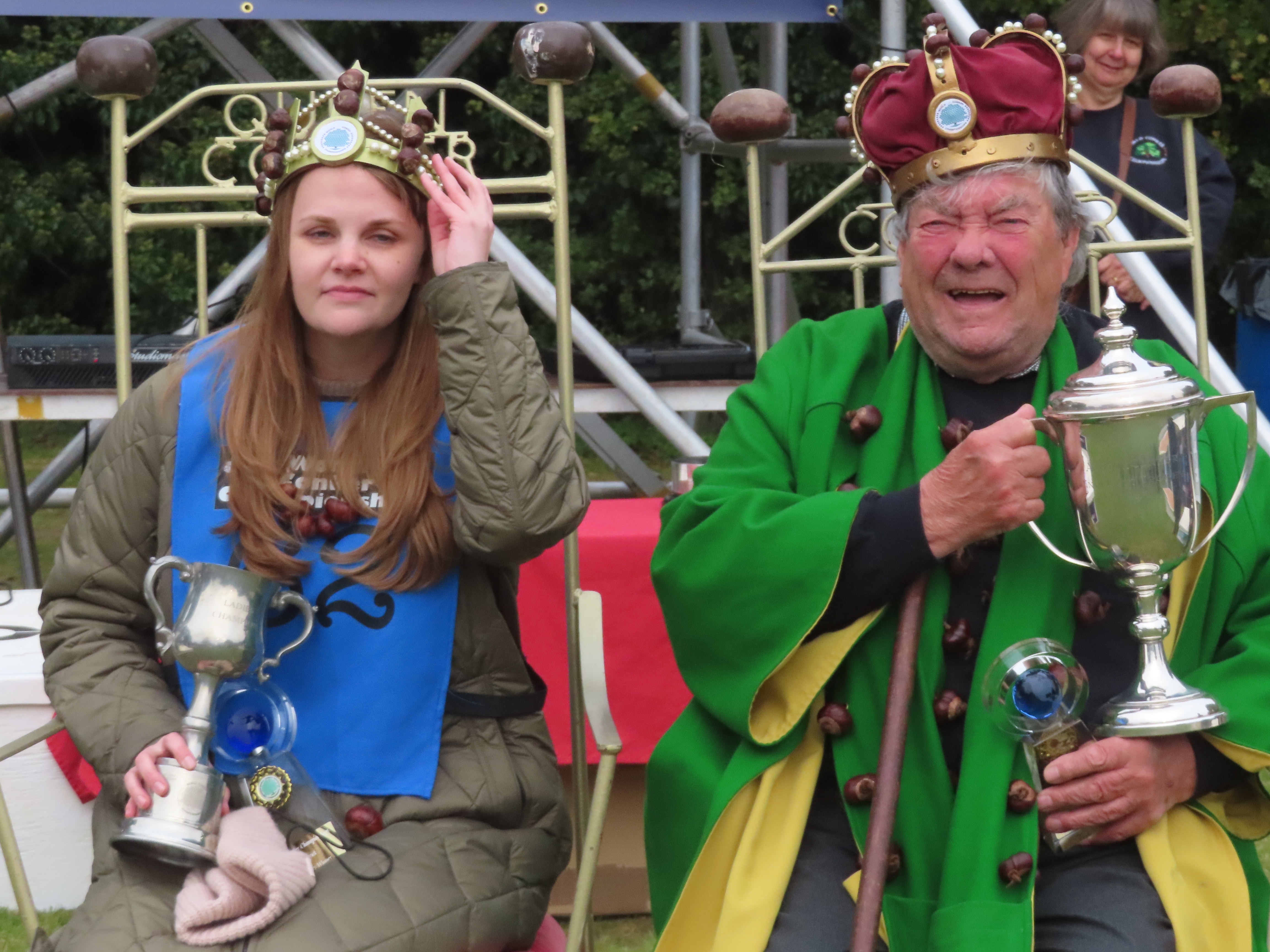 caption: Kelci Banschbach, who is originally from Indianapolis, became the first American winner of the World Conker Championships after beating David Jakins, the men's  winner. Jakins is accused of cheating in his games; he insists he did nothing wrong.