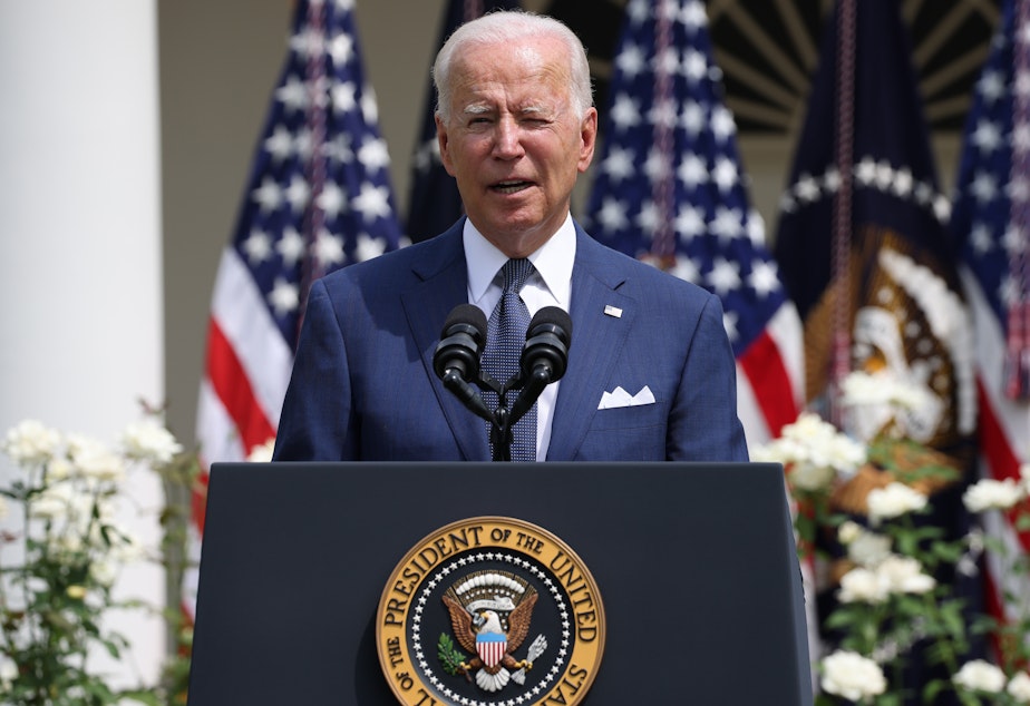 caption: President Biden delivers remarks during an event in the Rose Garden of the White House on Monday.