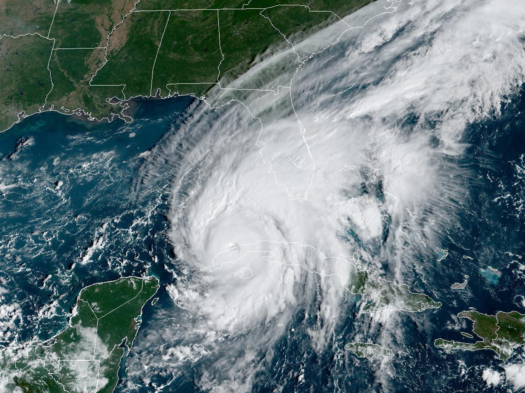 caption: Hurricane Ian passes over western Cuba in 2022, as captured by a U.S. weather satellite. Climate change is causing more extreme weather, and creates new challenges for weather forecasters.
