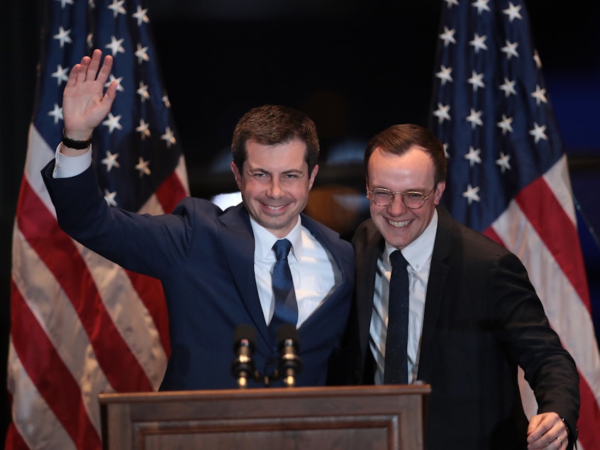 caption: With his husband, Chasten, by his side, former South Bend, Ind., Mayor Pete Buttigieg announces he is ending his campaign to be the Democratic nominee for president on Sunday in South Bend, Ind.