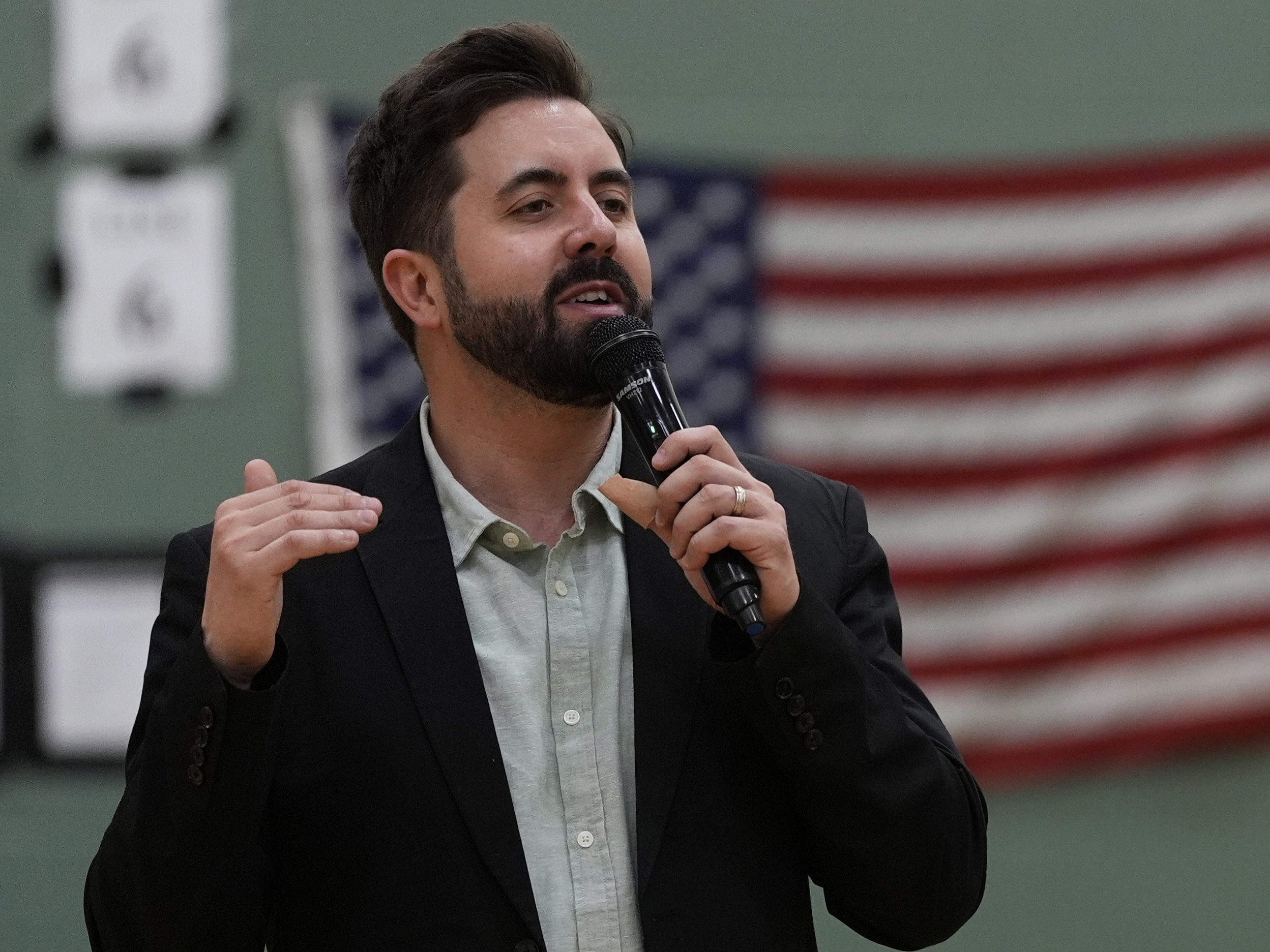 caption: River Church Cincinnati pastor Cory Bowman, who is Vice President Vance's half-brother, preaches during an Easter worship in April.