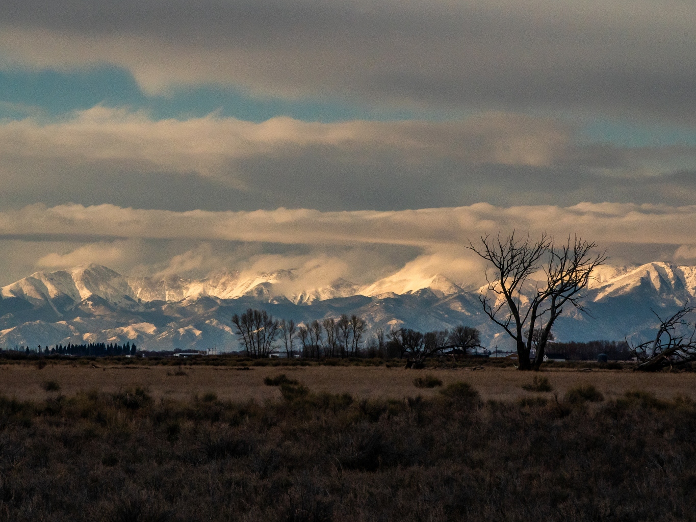 caption: The Sangre de Cristo mountains loom over Colorado's San Luis Valley. Many in this agricultural region voted for President Trump and are deeply concerned about cuts to Medicaid.