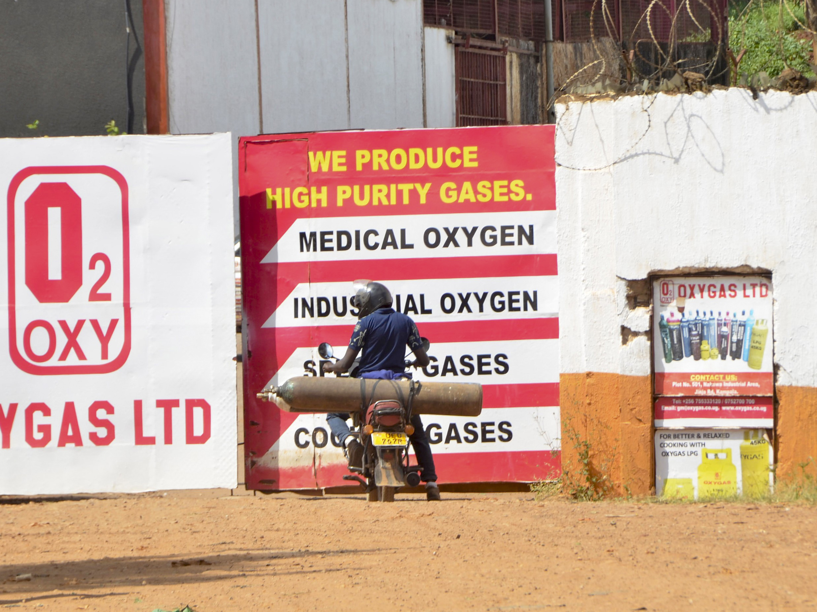 caption: An oxygen cylinder plant in Kampala, Uganda. The Ugandan army has started producing oxygen for state-run hospitals to ease the burden existing plants as COVID-19 cases — and demand for oxygen for severe illness — keep rising.