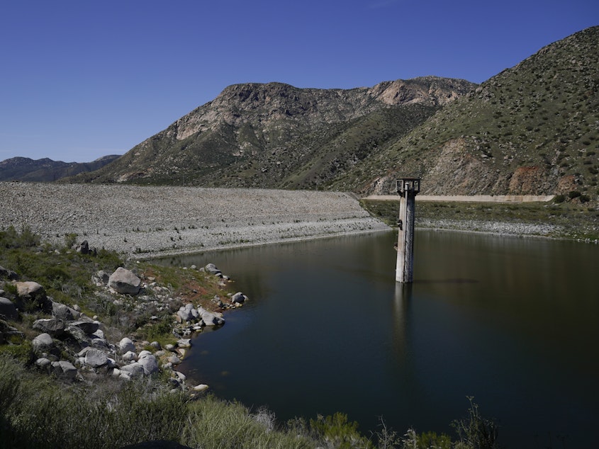 caption: Constructed four generations ago, the massive dam at El Capitan Reservoir in Lakeside, Calif., is capable of storing over 36 billion gallons of water — enough to supply every resident in San Diego for most of a year. Today, it's three-quarters empty — intentionally kept low because of concerns it could fail under the strain of too much water.