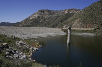 caption: Constructed four generations ago, the massive dam at El Capitan Reservoir in Lakeside, Calif., is capable of storing over 36 billion gallons of water — enough to supply every resident in San Diego for most of a year. Today, it's three-quarters empty — intentionally kept low because of concerns it could fail under the strain of too much water.
