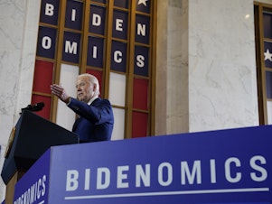 caption: President Joe Biden delivers remarks on the economy, Wednesday, June 28, 2023, at the Old Post Office in Chicago.