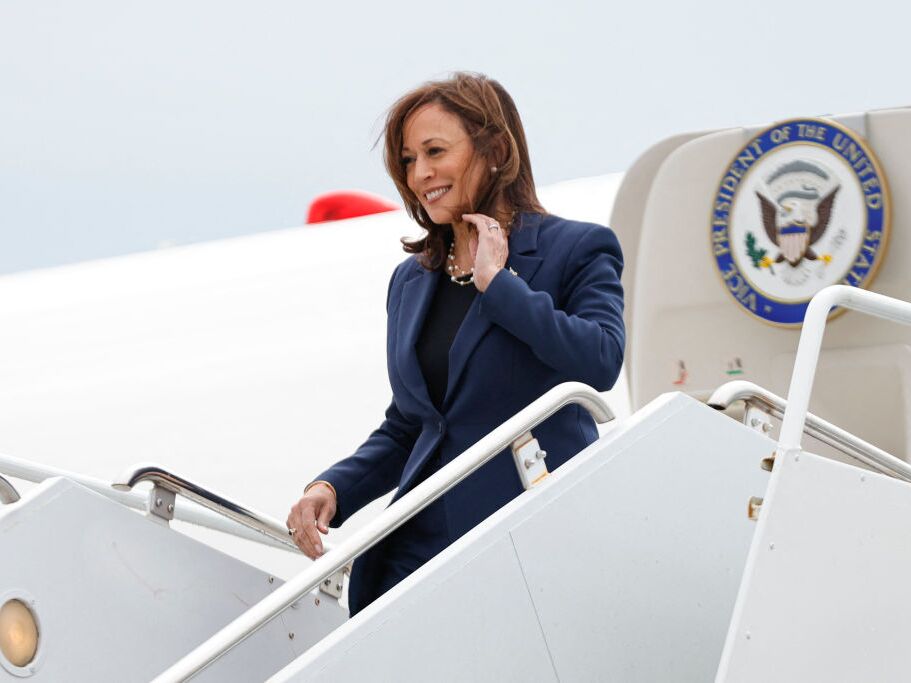 caption: Vice President Harris descends from Air Force 2 in Milwaukee ahead of a campaign event on Tuesday.