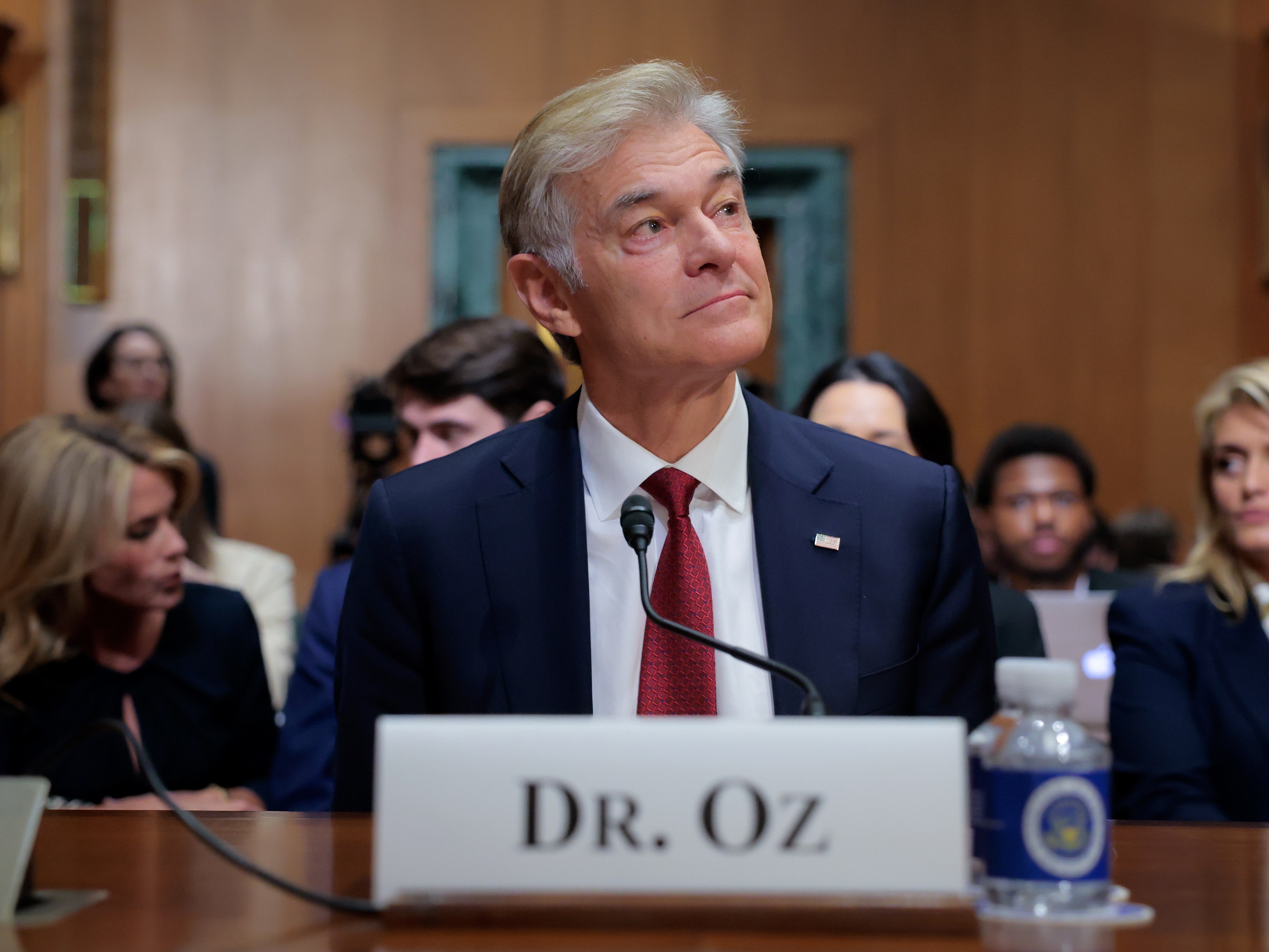 caption: Dr. Mehmet Oz at his confirmation hearing with the Senate Finance Committee on March 14. The committee voted to advance his nomination on Tuesday.