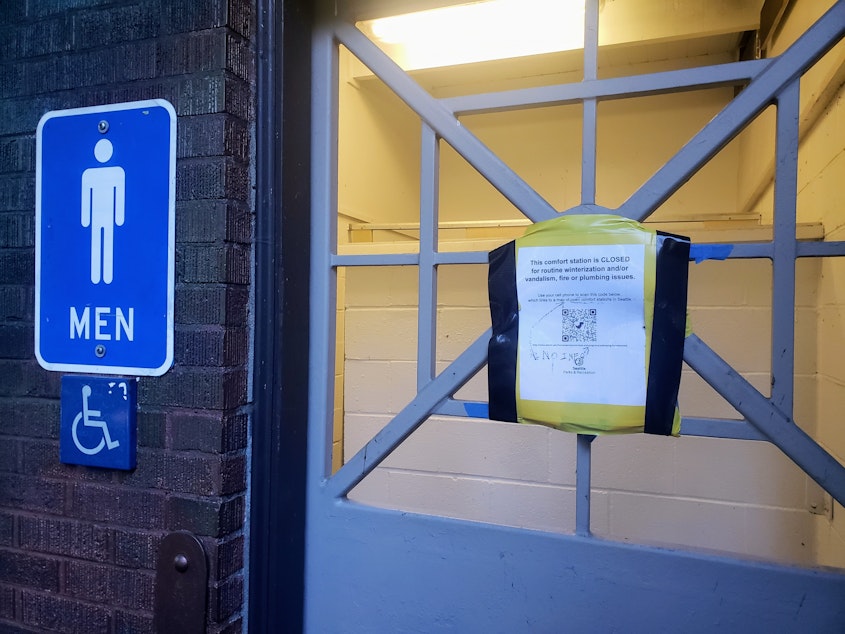 caption: A closed bathroom with a sign at West Seattle's Lincoln Park on Tuesday, Feb. 11, 2025.
