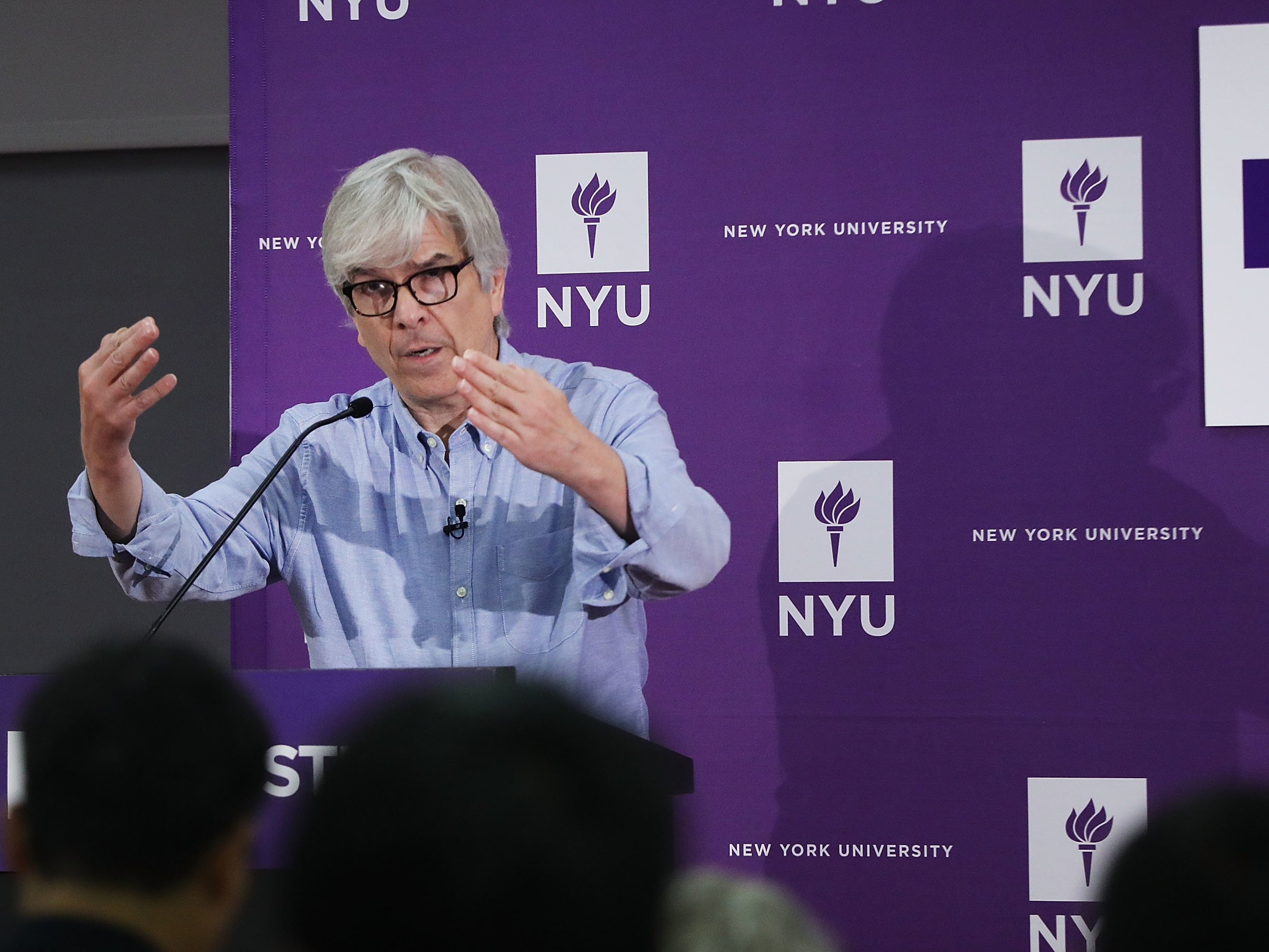 caption: New York University (NYU) professor Paul Romer speaks at a news conference after being named a winner of the 2018 Nobel Prize in Economics with professor William D. Nordhaus of Yale University.