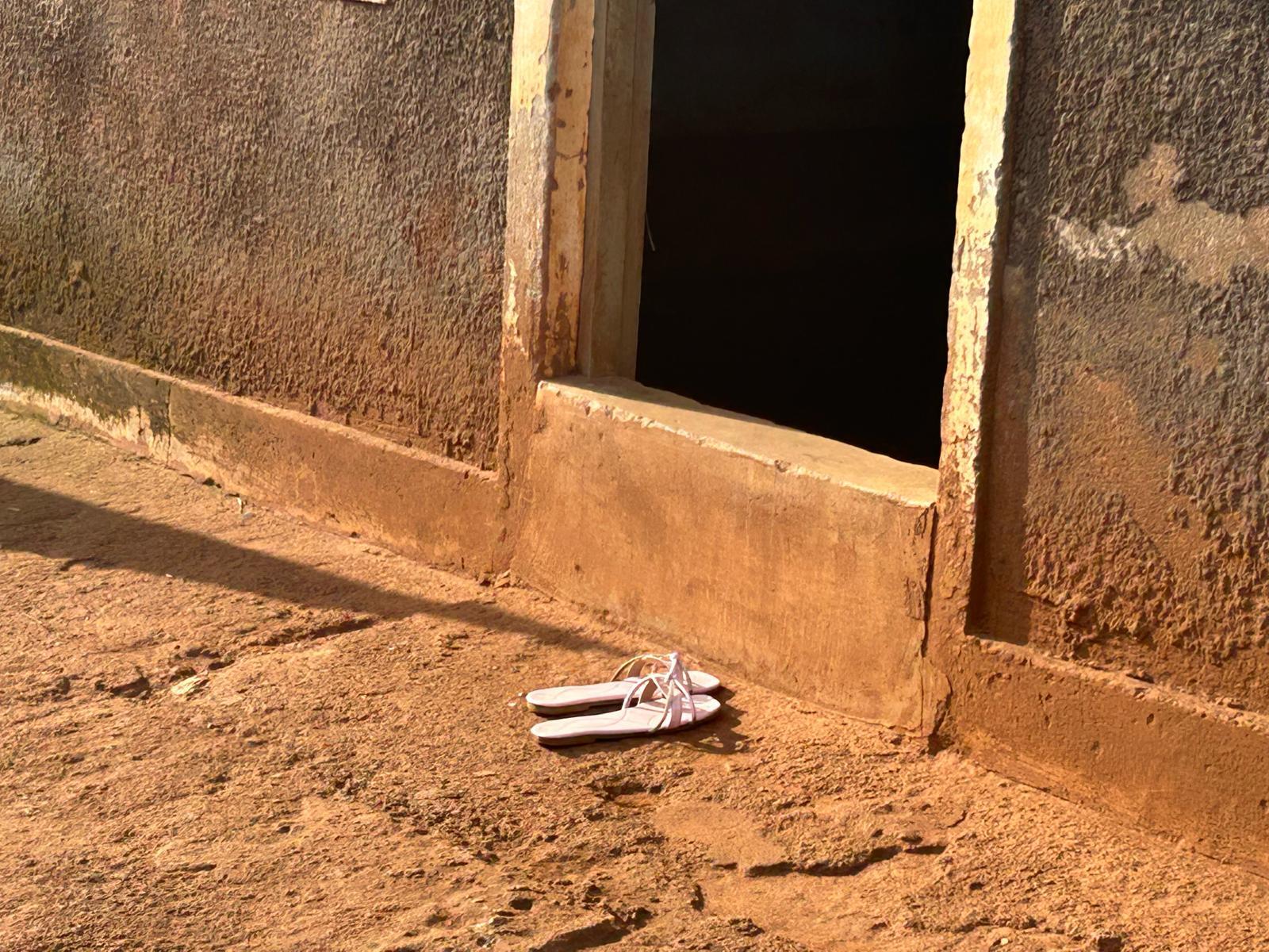 caption: Sandals outside a brothel on the Uganda-Kenya highway. Among the many losses after the U.S. aid cuts: free condoms and PrEP for sex workers.