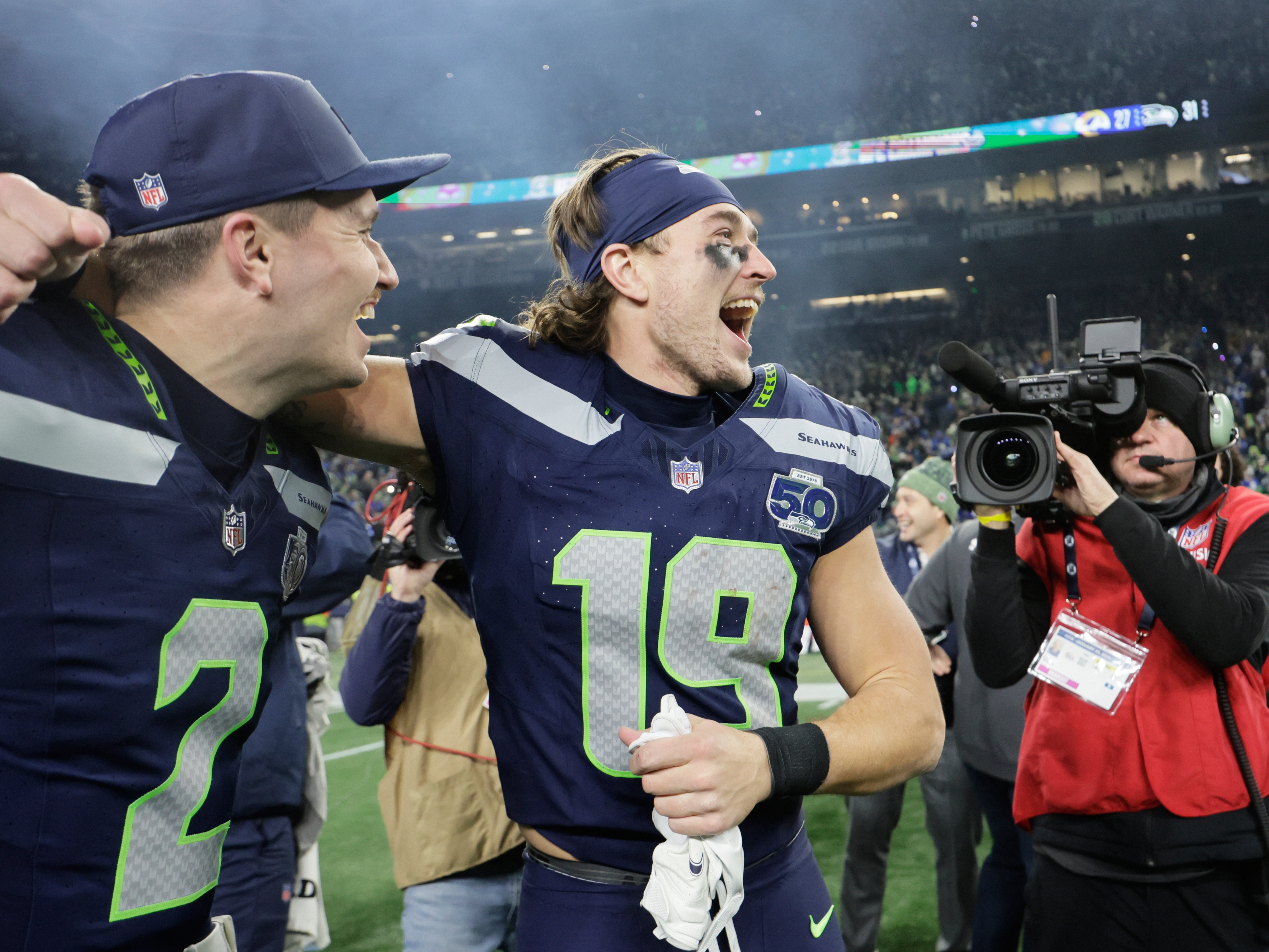 caption: Seattle Seahawks wide receiver Jake Bobo (19) celebrates with quarterback Drew Lock (2) after the NFC Championship NFL football game against the Los Angeles Rams, Sunday, Jan. 25, 2026, in Seattle.