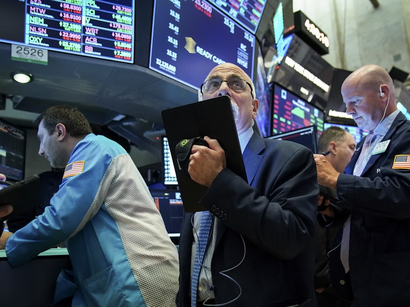 caption: NEW YORK, NY - Traders and financial professionals work ahead of the closing bell on the floor of the New York Stock Exchange (NYSE) on August 1, 2019 in New York City. On Wednesday, the stock market plummeted more than 600 points, over troubling economic data that could signal a global recession.