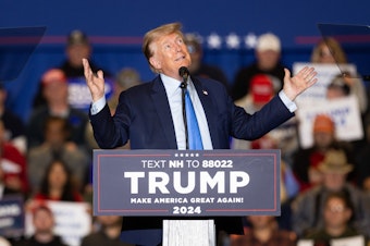 caption: Republican presidential candidate former President Donald Trump delivers remarks during a campaign event on November 11, 2023 in Claremont, New Hampshire.