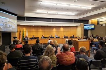 caption: The Burien City Council debates at a special meeting on Tuesday, May 30, 2023.
