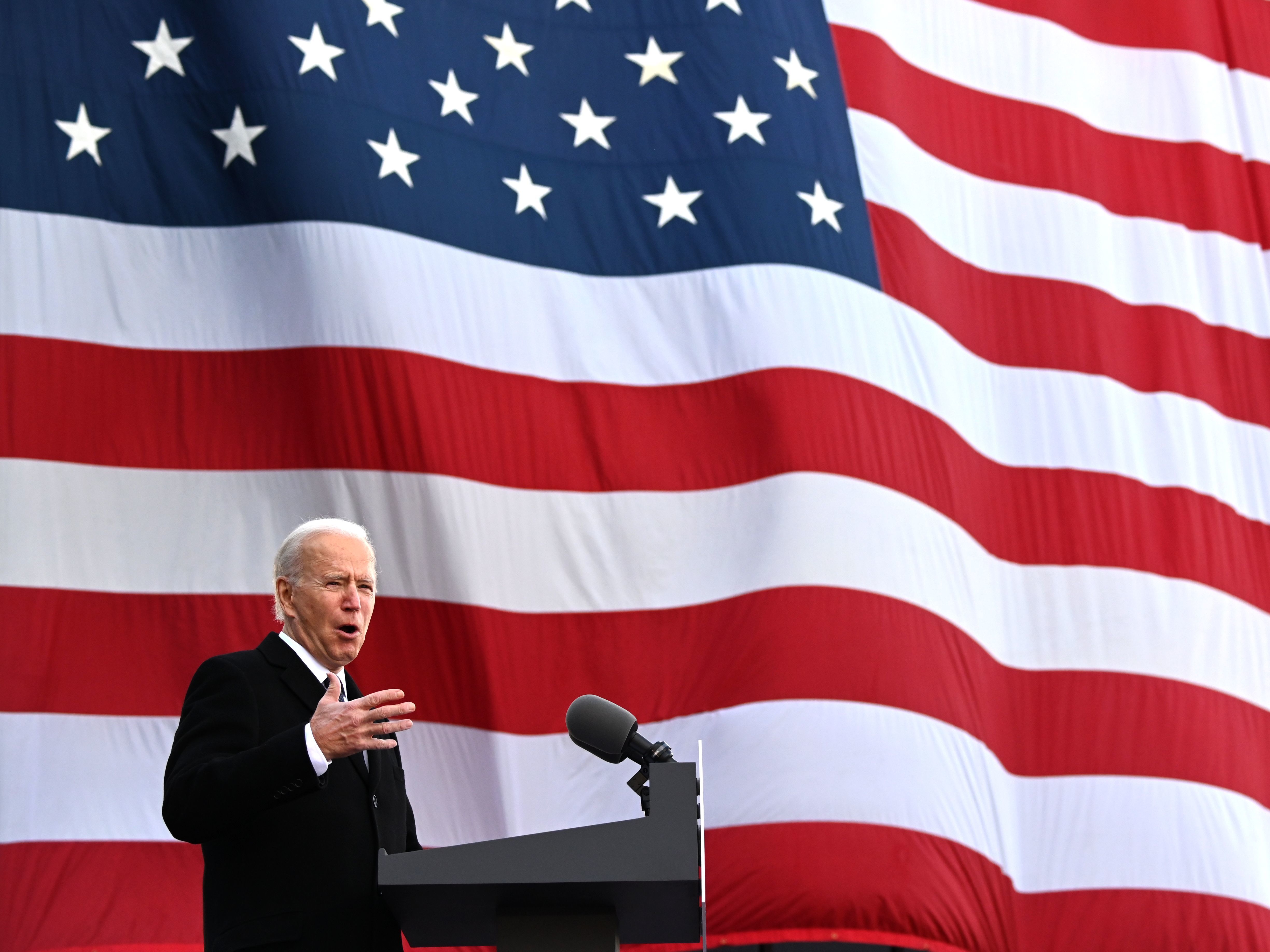 caption: President-elect Joe Biden speaks Tuesday at a National Guard/Reserve Center in New Castle, Del., named after his late son, Beau, before departing for Washington, D.C.