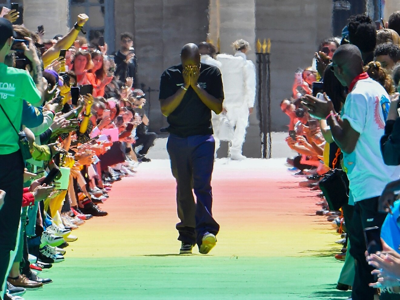 caption: Virgil Abloh's debut runway show for Louis Vuitton in Paris, France, in 2018.