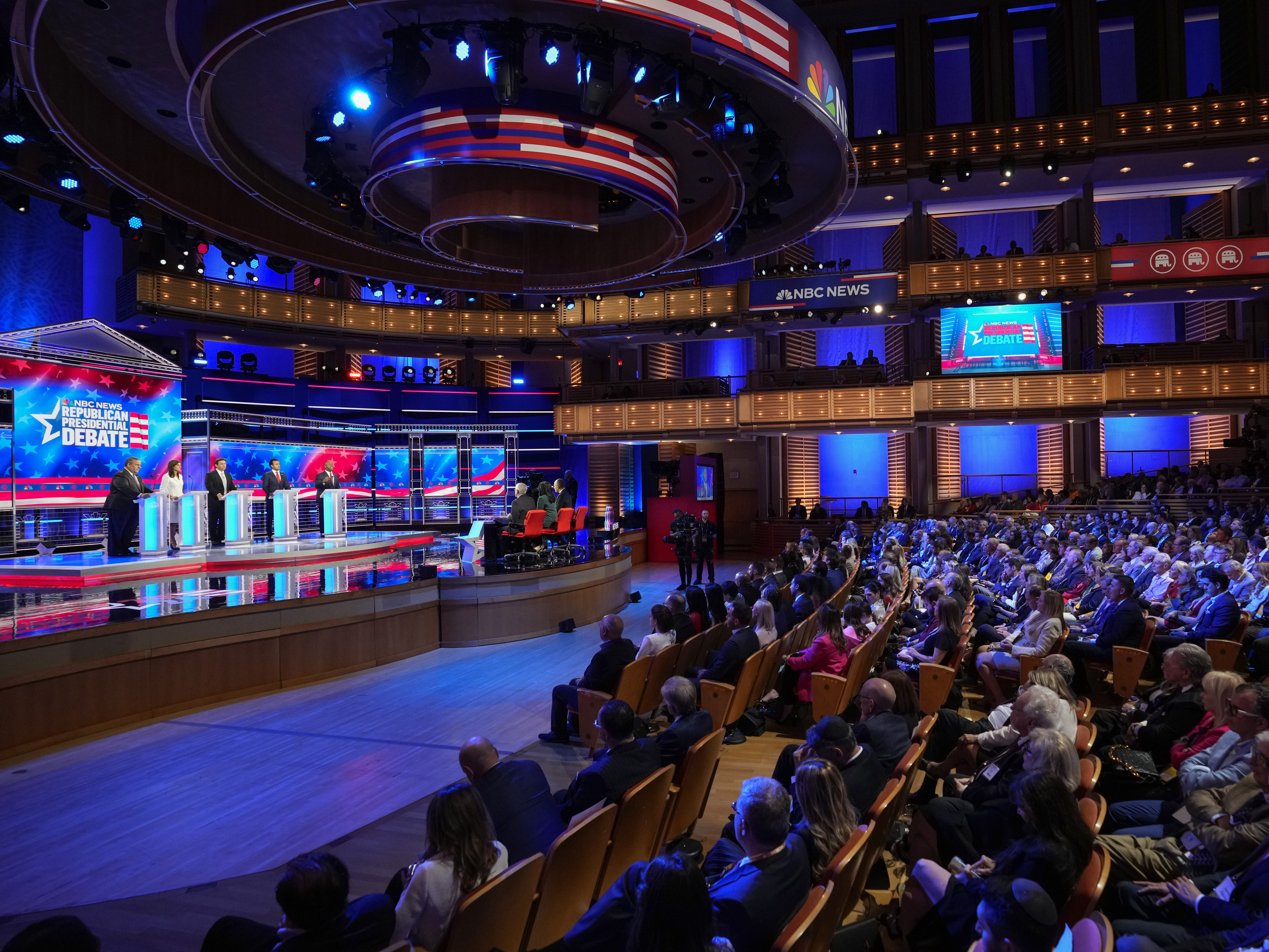 caption: Republican presidential candidates from left, former New Jersey Gov. Chris Christie, former U.N. Ambassador Nikki Haley, Florida Gov. Ron DeSantis, businessman Vivek Ramaswamy and Sen. Tim Scott, R-S.C., participate in a Republican presidential primary debate hosted by NBC News Wednesday in Miami.