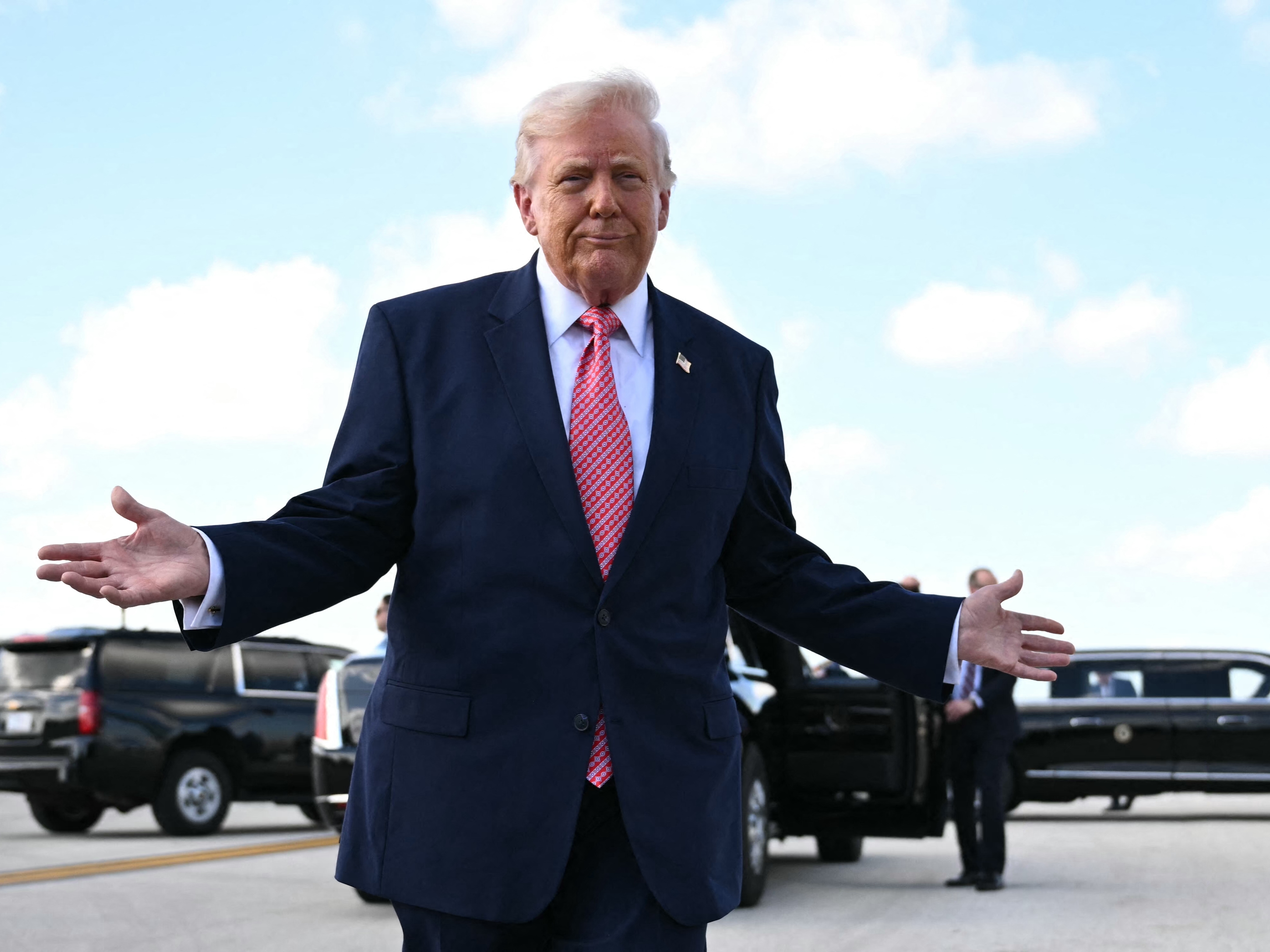 caption: US President Donald Trump speaks to the press upon arrival at Miami International Airport in Miami, Florida, on March 27, 2026. Trump will deliver remarks at the FII PRIORITY Summit in Miami Beach.