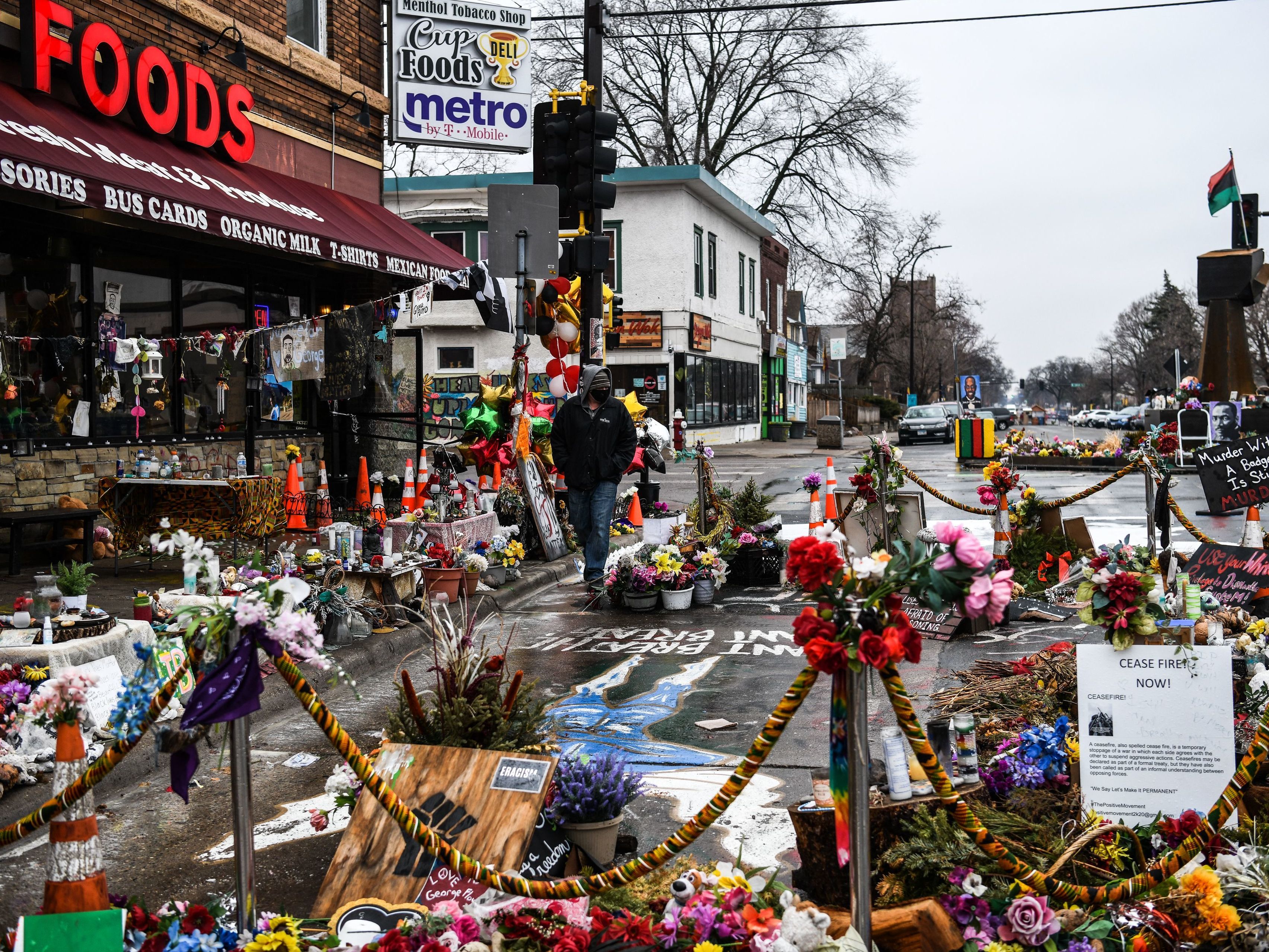 caption: A makeshift memorial in Minneapolis honors George Floyd as jury selection begins in the trial of former police officer Derek Chauvin.