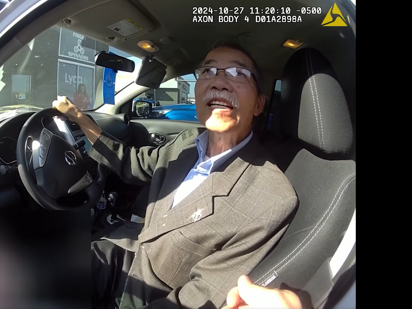 caption: A screenshot from the bodycam footage shows 70-year-old Lich Vu before he was slammed to the ground by an Oklahoma City police officer on Oct. 27.