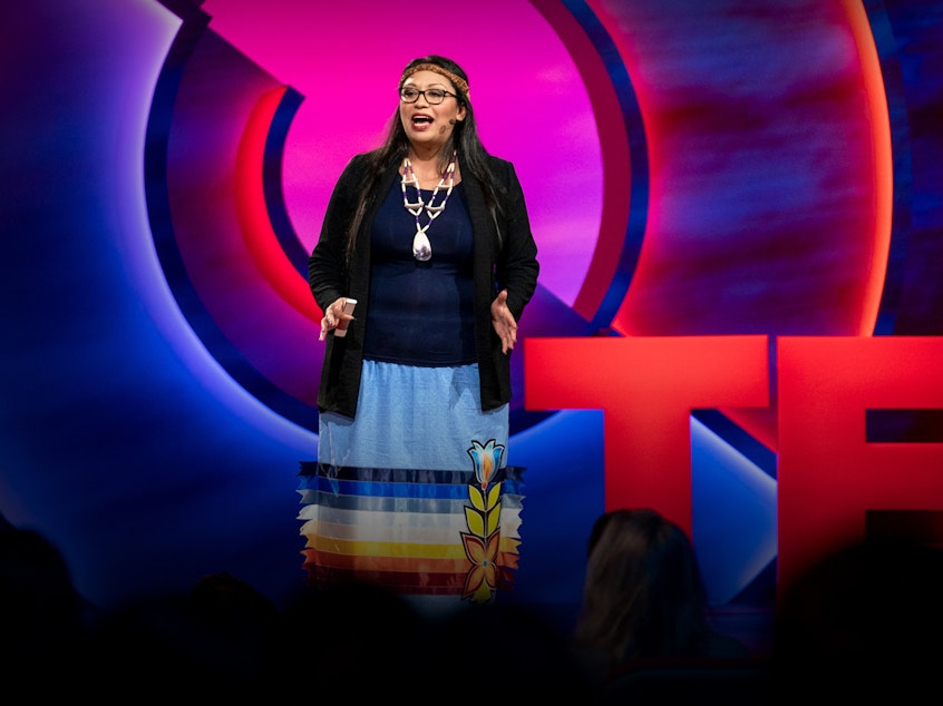caption: Legal scholar Kelsey Leonard speaks from the TED stage.