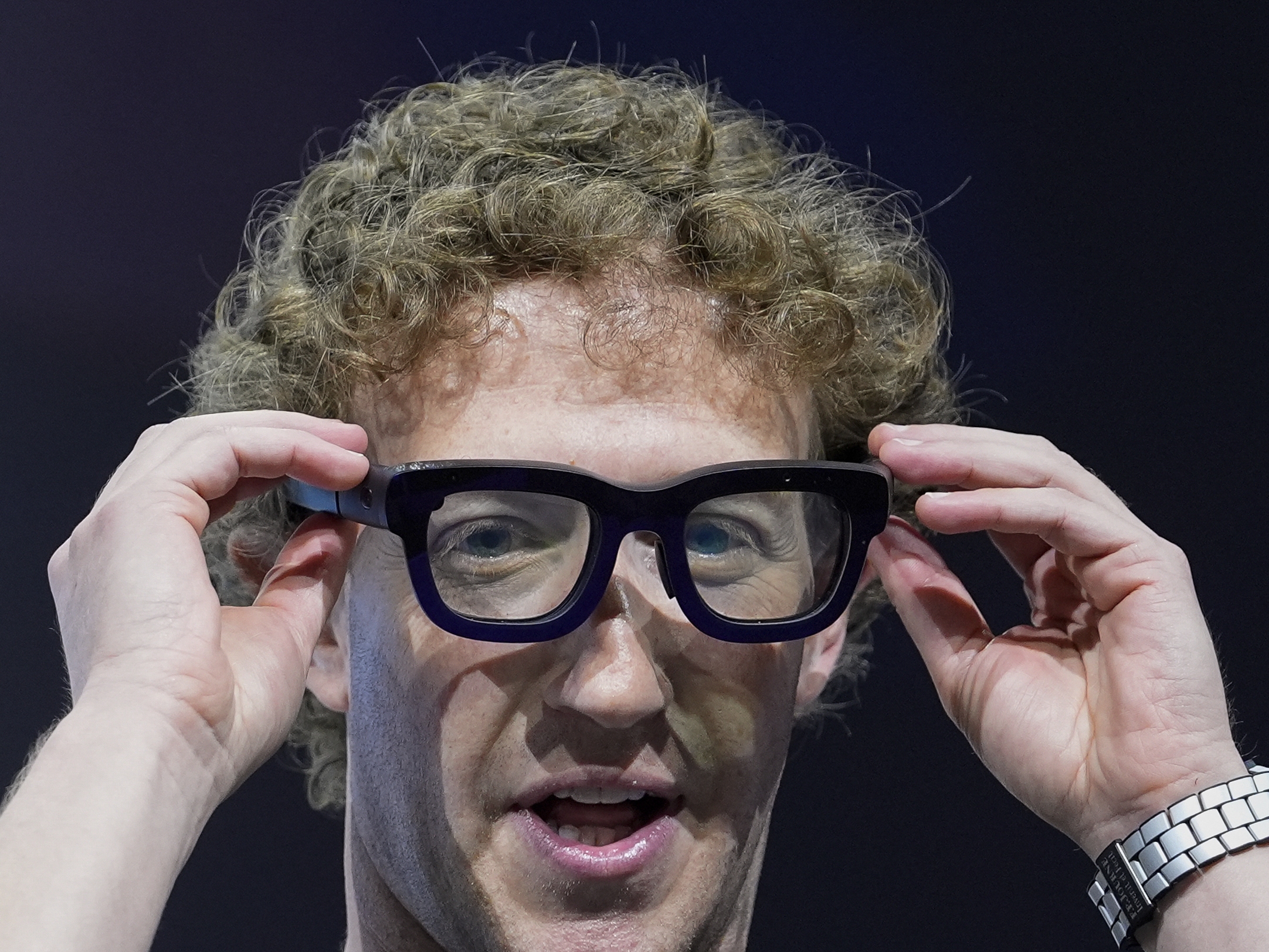 caption: Mark Zuckerberg wears a pair of Orion AR glasses during the Meta Connect conference on Sept. 25, 2024, in Menlo Park, Calif.
