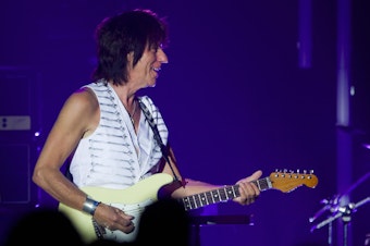 caption: Guitarist Jeff Beck performs during the 43rd Montreux Jazz Festival. The influential guitarist died on January 10, 2023 after contracting bacterial meningitis.
