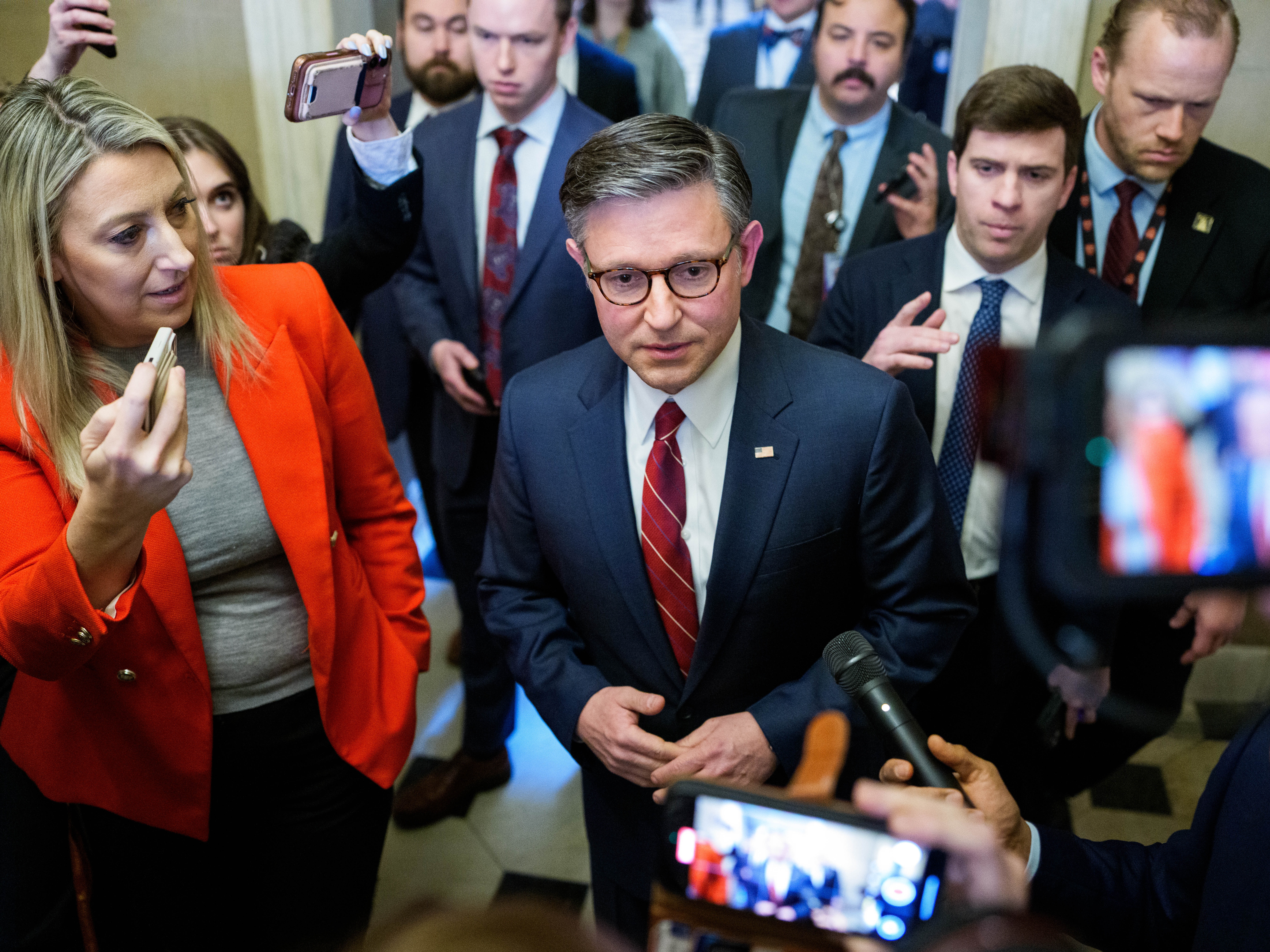 caption: House Speaker Mike Johnson, R-La., speaks with reporters following a rules vote on funding the U.S. government, at the U.S. Capitol on Feb. 3.