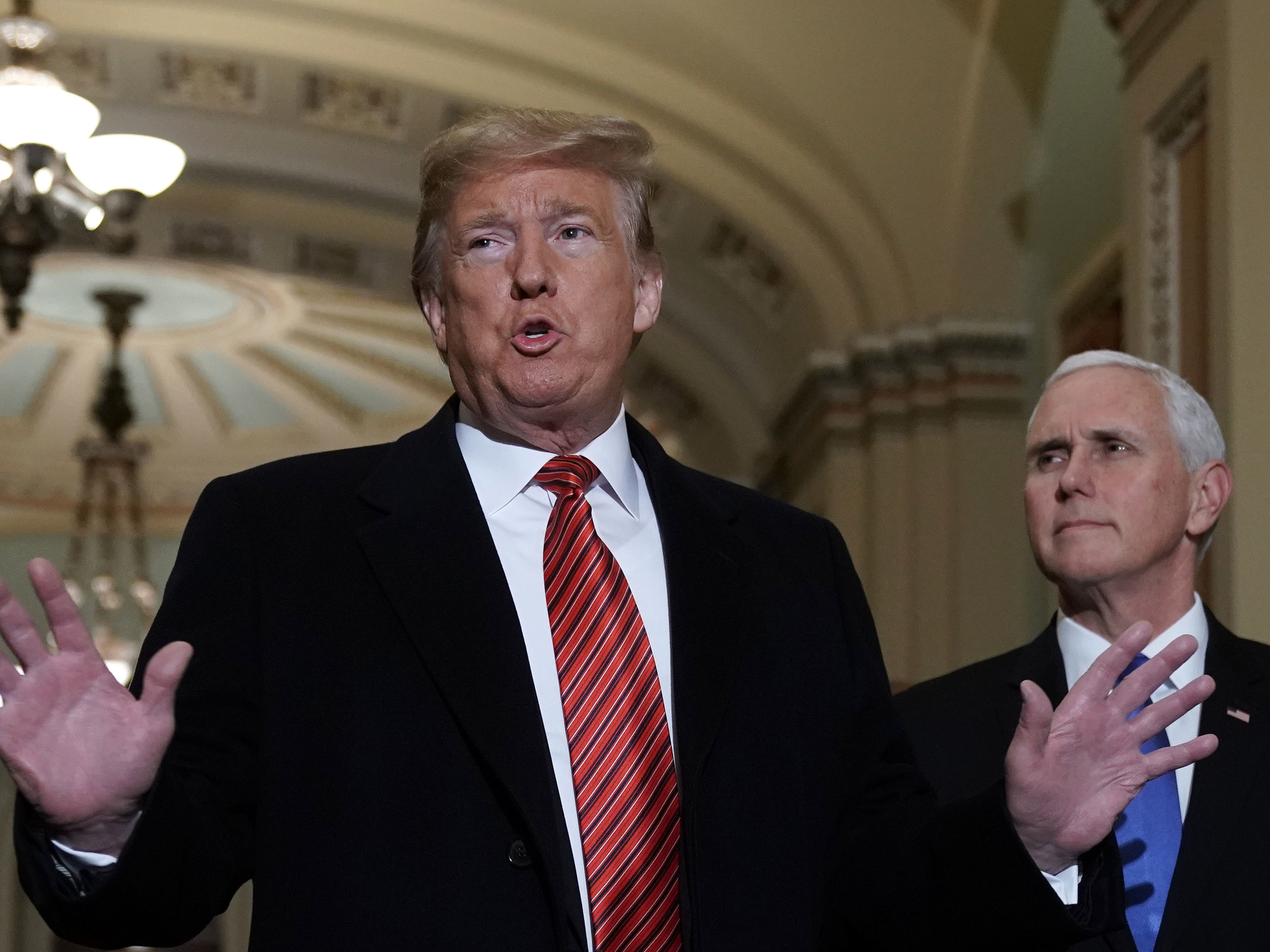 caption: President Trump and Vice President Pence arrive at the U.S. Capitol to attend the weekly Republican Senate policy luncheon on Wednesday.