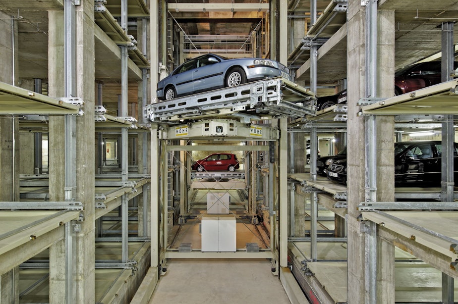 caption: This robotic parking garage by manufacturer Woehr is similar to the one planned for Seattle Cancer Care Alliance in Seattle. It can be taken apart, like Legos, leaving an underground box that may be converted to some other use when the parking garage becomes obsolete.
