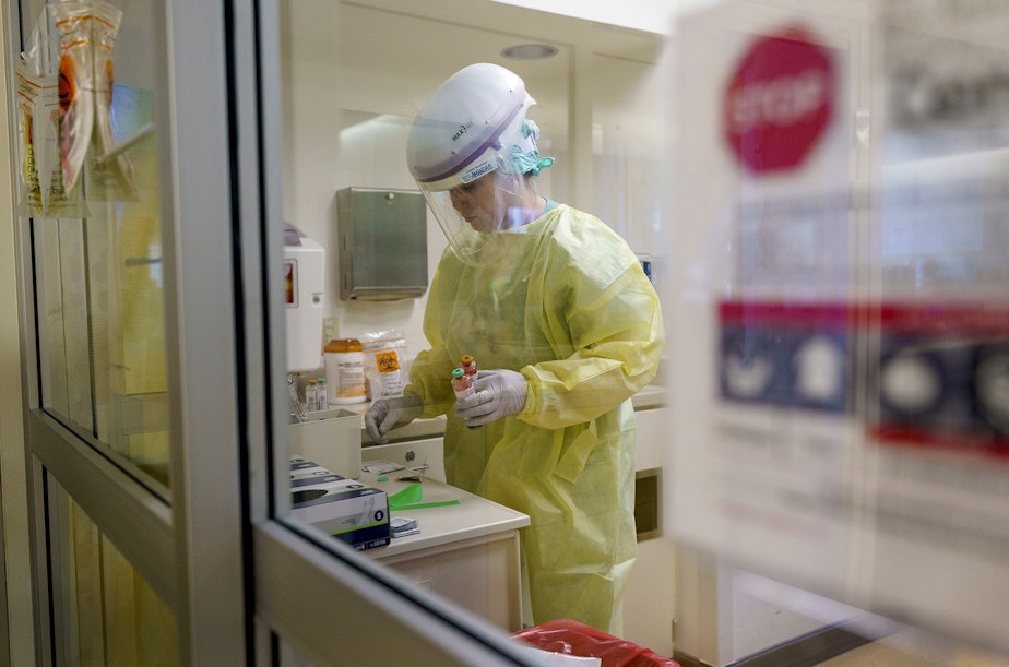 caption: Amanda Bryant, a registered nurse, cares for a critically ill patient in the ICU at Oregon Health and Science University in Portland, Ore., Thursday, Aug. 19, 2021. There is no cure for COVID-19. Health care workers work to keep patients alive long enough for the infection to subside and their body can begin to recover. 