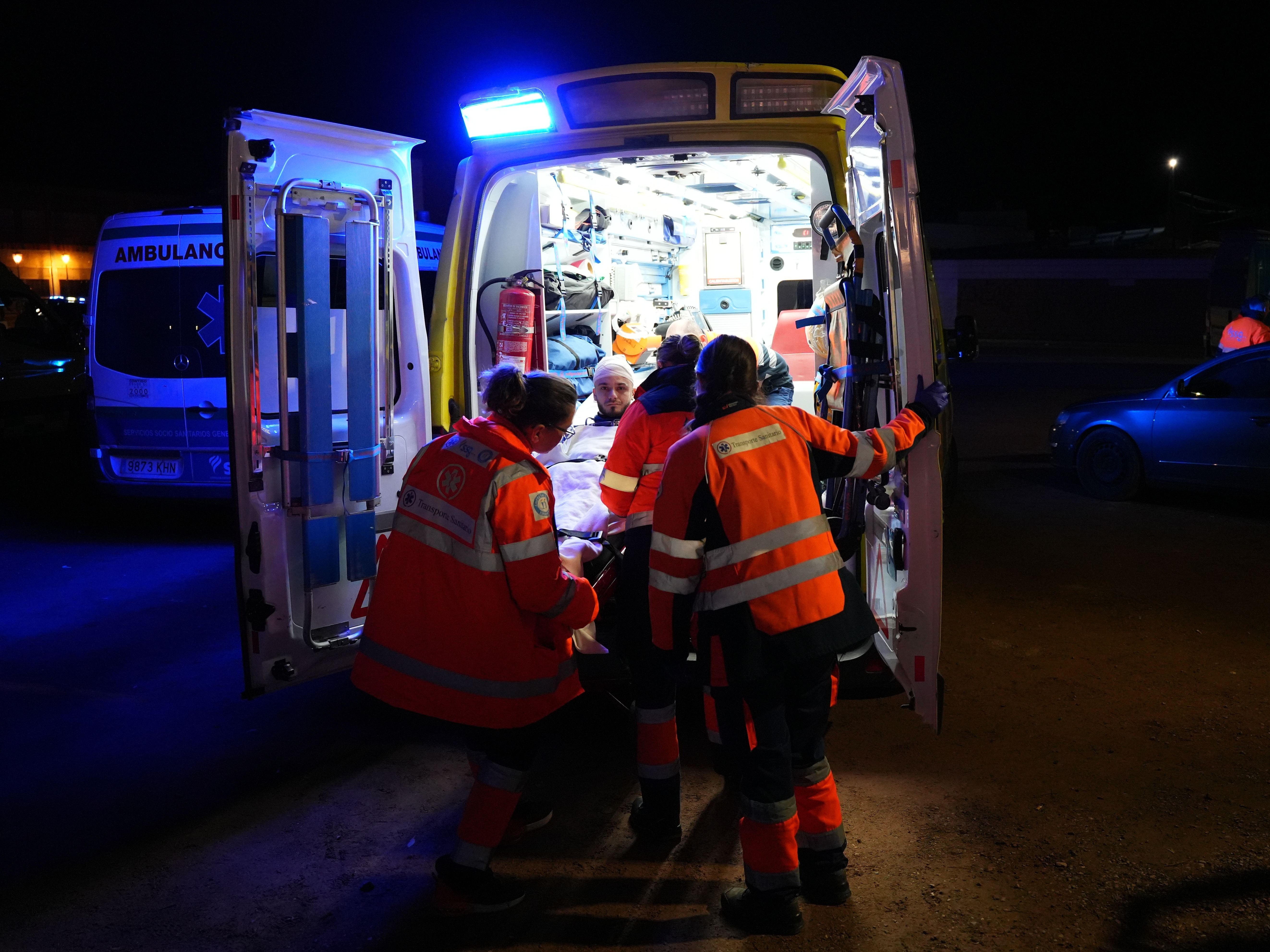 caption: An injured person is transported by ambulance in Adamuz, near Córdoba, southern Spain, Monday, Jan. 19, 2026, after a high-speed train derailed and collided with another train.