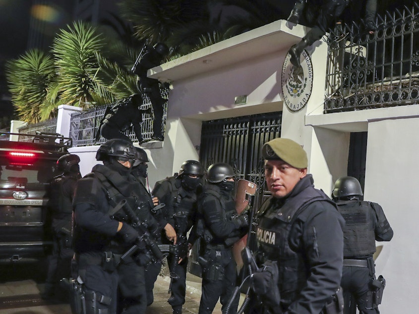 caption: Police break into the Mexican embassy in Quito, Ecuador, Friday, April 5, 2024.