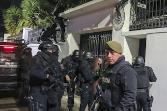 caption: Police break into the Mexican embassy in Quito, Ecuador, Friday, April 5, 2024.