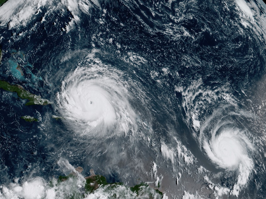caption: A satellite image from September 2017 shows Hurricane Irma, left, and Hurricane Jose, right, in the Atlantic Ocean. NOAA says the average annual number of tropical storms in the Atlantic has slightly increased.