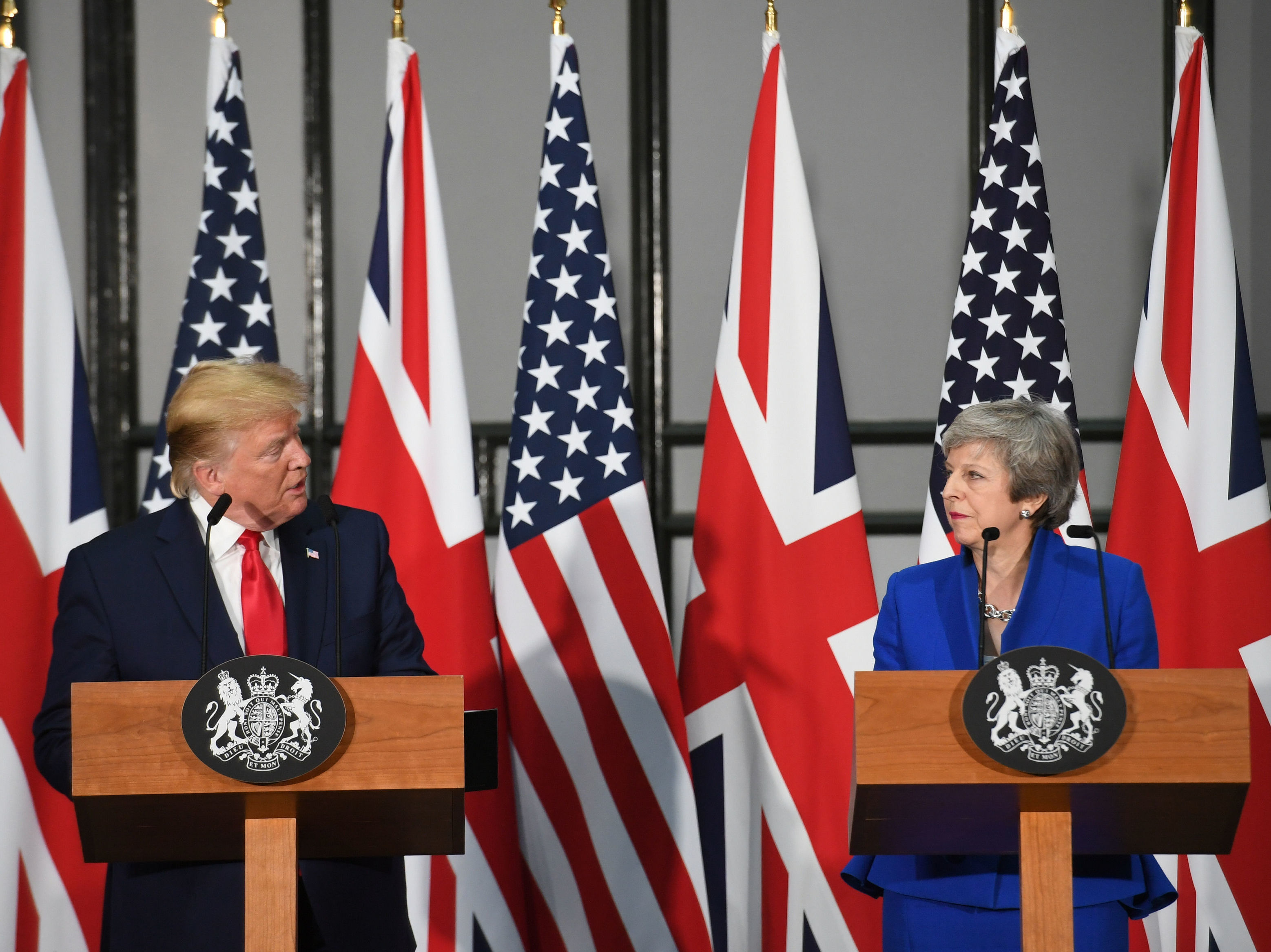caption: President Trump and U.K. Prime Minister Theresa May take questions from reporters in London Tuesday.